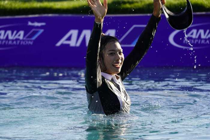 Patty Tavatanakit celebrates in Poppie's Pond after winning the 2021 ANA Inspiration.